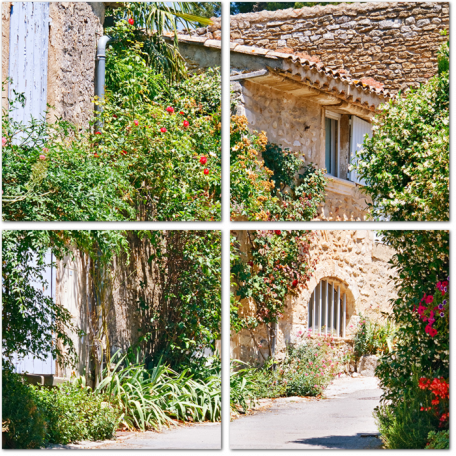 Каменные дома среди красивых цветов в Провансальской деревне