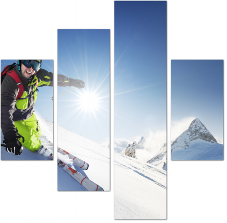 Лыжник смотрит в объектив, съезжая с горы