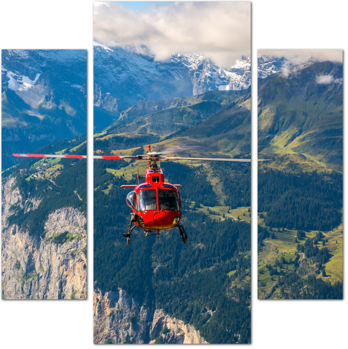 Красный вертолет летит в горах