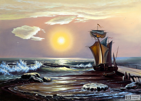 Парусная лодка на закате солнца