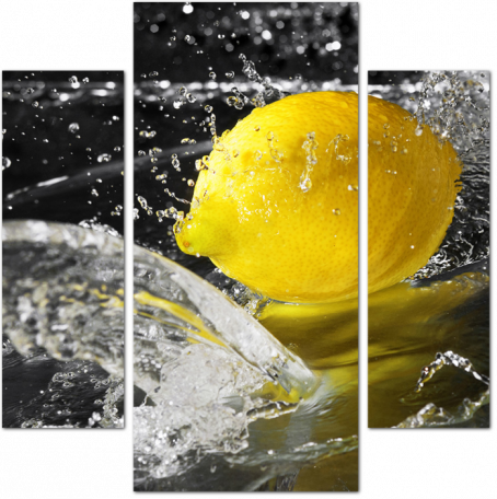Брызги воды на желтом лимоне
