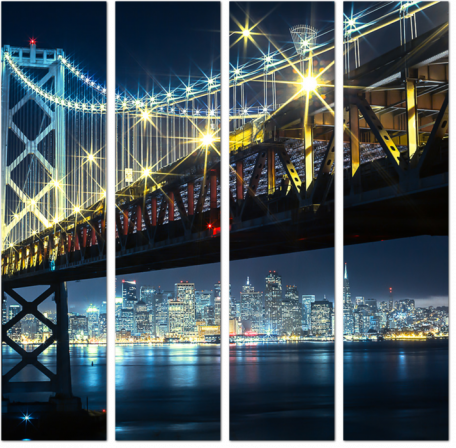 Мост с яркими фонарями на фоне мегаполиса ночью