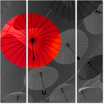 Красный и черные зонты висят над головами