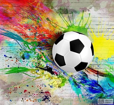Футбольный мяч на фоне цветной кирпичной стены